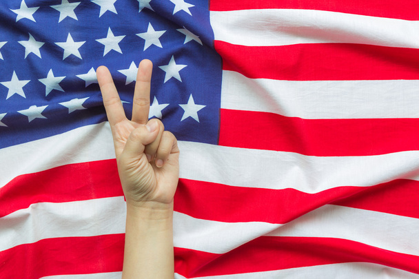 Hand over American flag  - Foto, Bild
