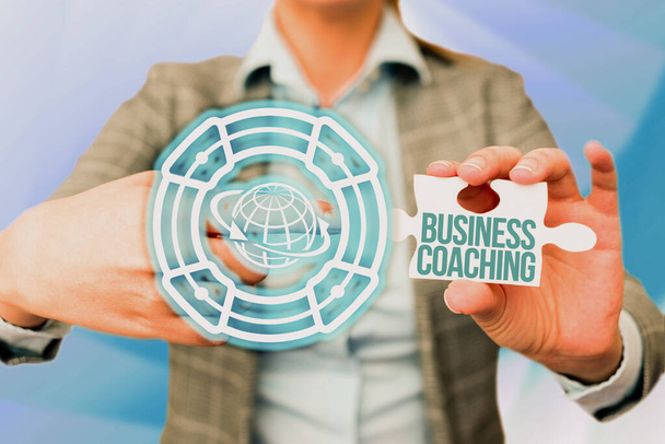 Conceptual caption Business Coaching. Internet Concept providing support and occasional advice to an individual Business Woman Pointing Jigsaw Puzzle Piece Unlocking New Futuristic Tech. - Photo, image