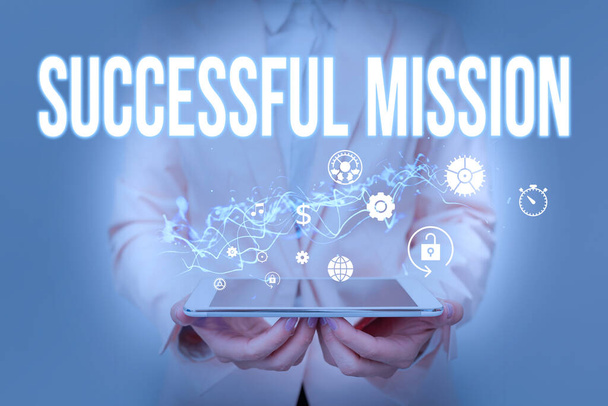 Sign displaying Successful Mission. Business idea complete fulfilment of all objectives of a space mission Lady In Suit Holding Phone And Performing Futuristic Image Presentation. - Photo, Image