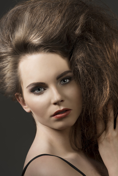close-up of girl with voluminous hair  - Fotó, kép