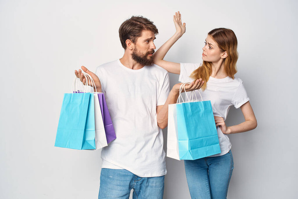 young couple with shopping bags entertainment sale - Photo, Image