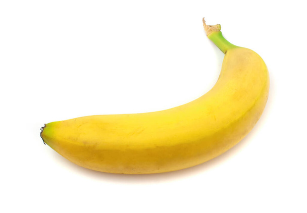 Közelkép egy banán fekvő elszigetelt fehér alapon. - Fotó, kép