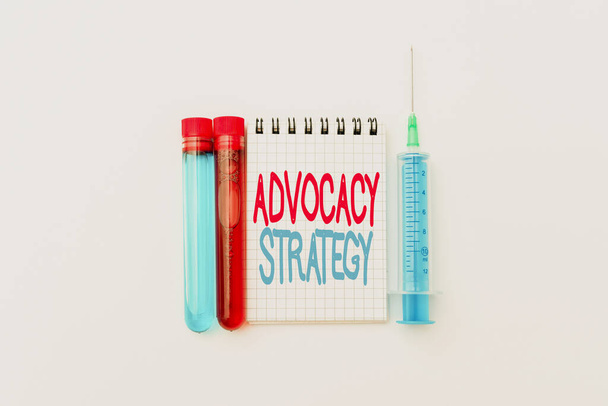 Handwriting text Advocacy Strategy. Business showcase activity by an individual that aims to influence decisions Research Notes For Virus Prevention, Planning Medical Procedures - Photo, Image