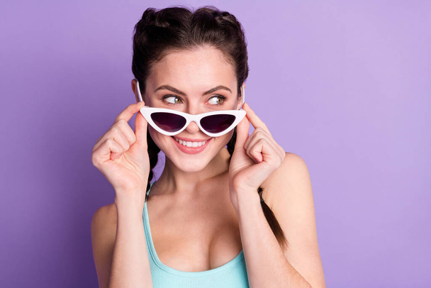 Close-up portrait of attractive cheerful girlish girl touching specs looking isolated over violet purple color background - Zdjęcie, obraz