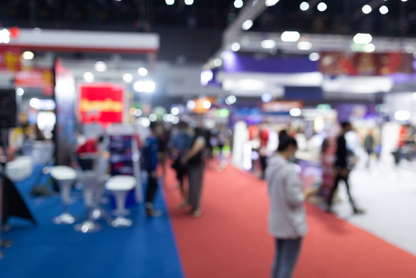 Abstract blur people in exhibition hall event trade show expo background. Business convention show, job fair, or stock market. - Photo, Image