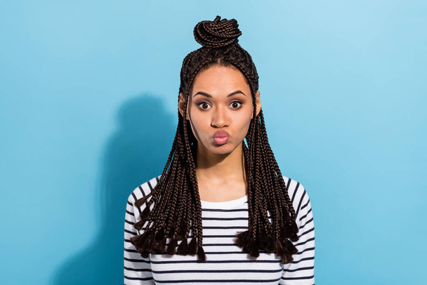 Photo of young attractive black girl pouted lips send air kiss you isolated over blue color background - Foto, imagen
