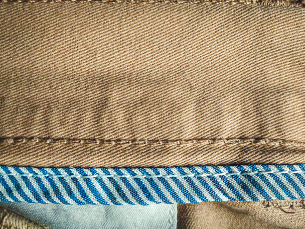 oude khadi doek textuur achtergrond. licht natuurlijk linnen textuur voor de achtergrond.Gouden geel linnen weefsel van tafelkleed textuur achtergrond. - Foto, afbeelding