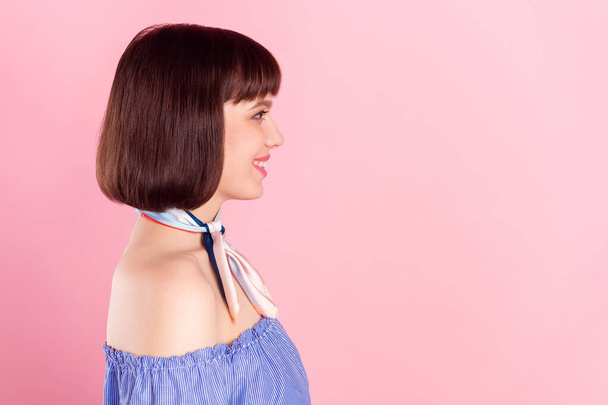 Side profile photo portrait of girl looking copyspace wearing blouse smiling isolated on pastel pink color background - Φωτογραφία, εικόνα