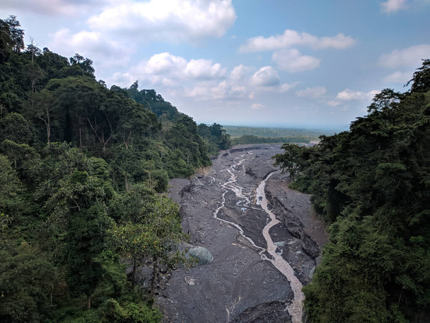 view from the top of the bridge in the picket zero area of Lumajang district showing the former lava and sand flows from Mount Semeru - Valokuva, kuva