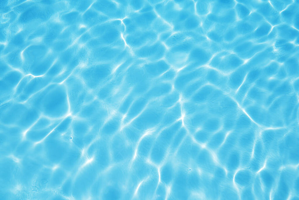 Blue surface of water in swimming pool, Texture or background. - Zdjęcie, obraz