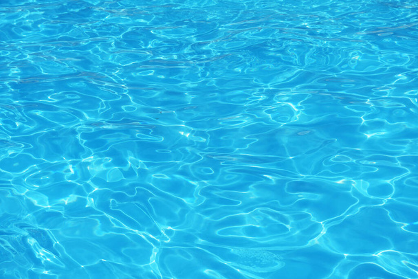 Blue surface of water in swimming pool, Texture or background. - Fotó, kép
