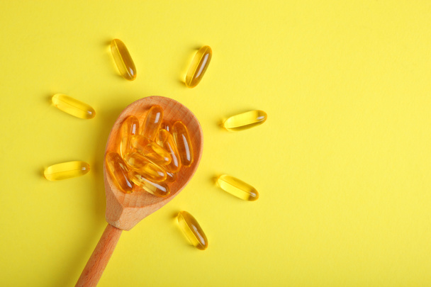 Omega 3 capsules on a colored background close-up with place for text. - Photo, Image