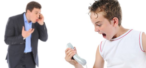 Father and son is arguing while talking over the telephone - Фото, изображение