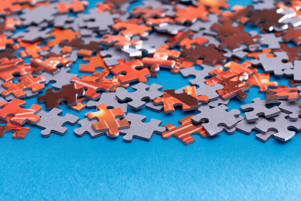 Colorful Jigsaw Puzzle on Blue Background - Foto, afbeelding