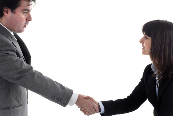 Business partners are shaking hands on a deal - Foto, afbeelding