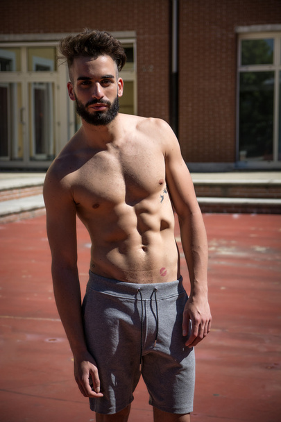 Handsome shirtless young man with beard - Fotoğraf, Görsel