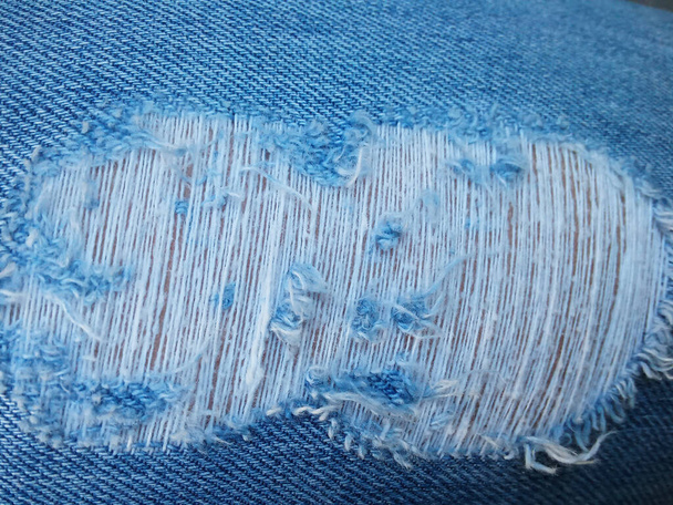 calças azuis quebradas textura tecido foto - Foto, Imagem