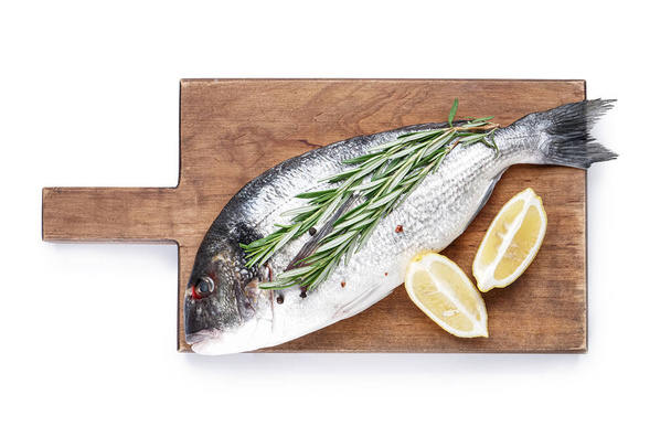 Board with raw dorado fish on white background - Φωτογραφία, εικόνα