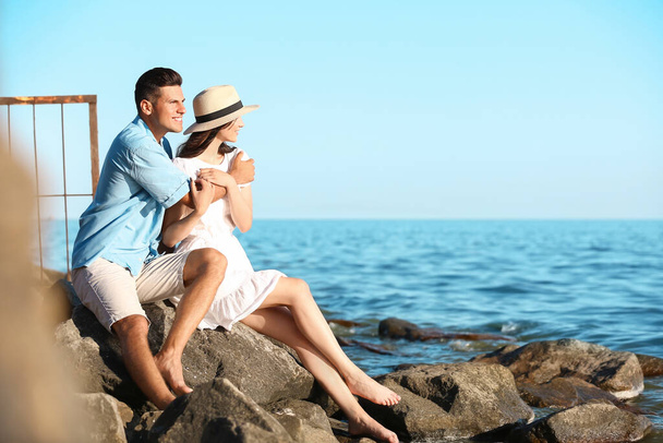 Happy young couple on sea beach - Foto, immagini