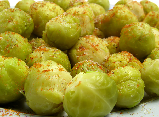 Seasoned brussels sprouts arranged on a plate - Photo, Image