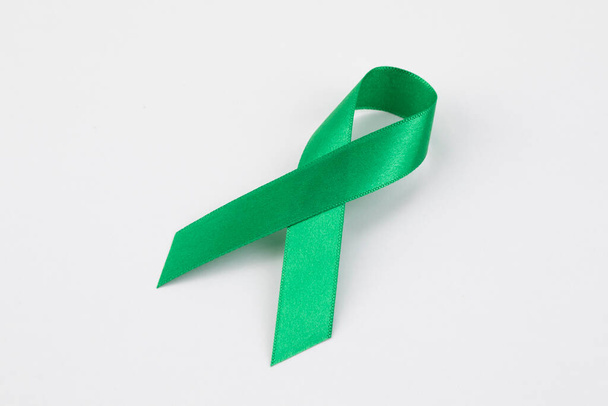 green ribbon on white background - Фото, изображение