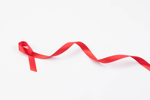 red ribbon on white background - Foto, Imagem