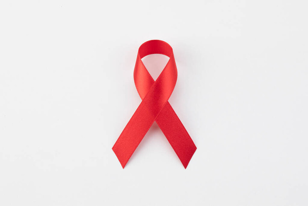 red ribbon on white background - Φωτογραφία, εικόνα