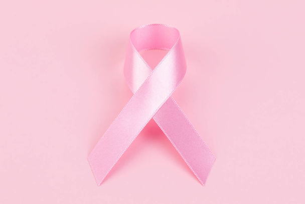 pink ribbon on pink background - Фото, зображення