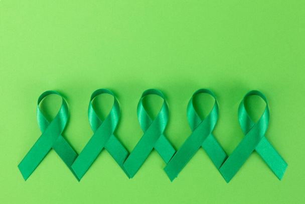 green ribbons on green background - Fotó, kép