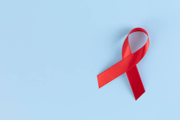 Red ribbon on sky blue background - Foto, immagini
