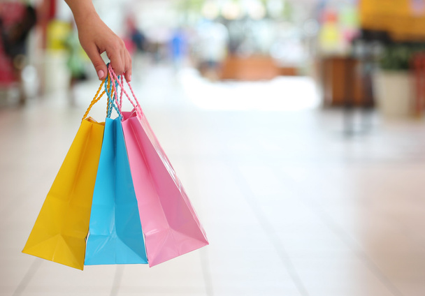 Shopping! Female Hand Holding Colorful Shopping Bags in Shopping - Фото, изображение