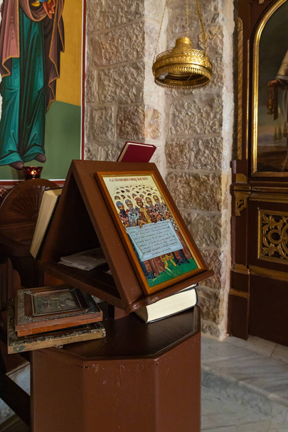 A stand with an icon in the hall in the small monastery of St. George on the border of the Jewish and Armenian quarters in the old city of Jerusalem, Israel - Photo, Image