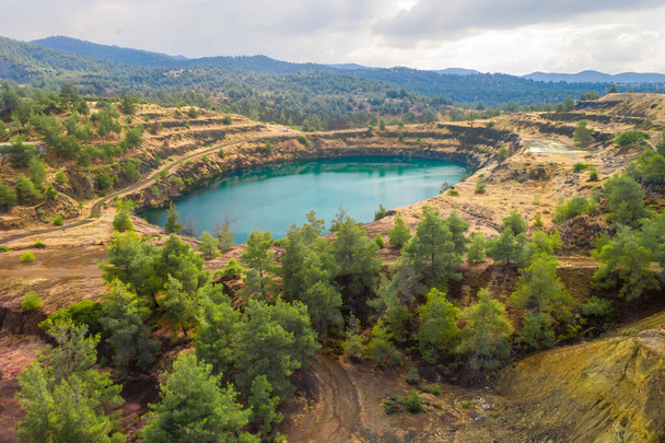Restoration of former open pit copper mining area near Kapedes, Cyprus with forest restored over old waste dumps - Photo, Image