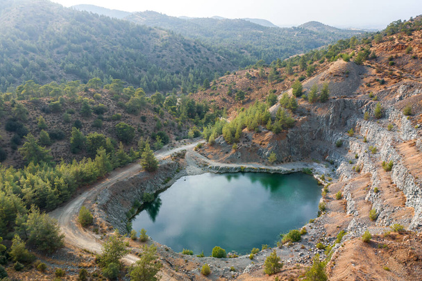 Lake in abandoned pit of basalt quarry near Machairas, Cyprus. Aerial landscape - Photo, Image