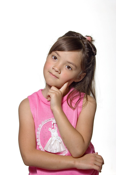 A young girl strikes a thinking pose. - Photo, Image