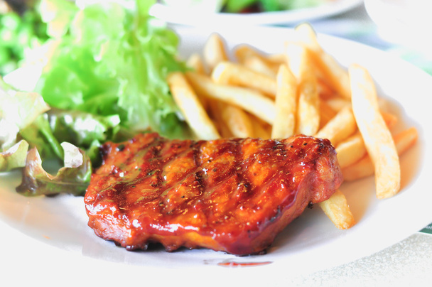 Pork loin steak in a dish Serve with French fries  - Photo, Image
