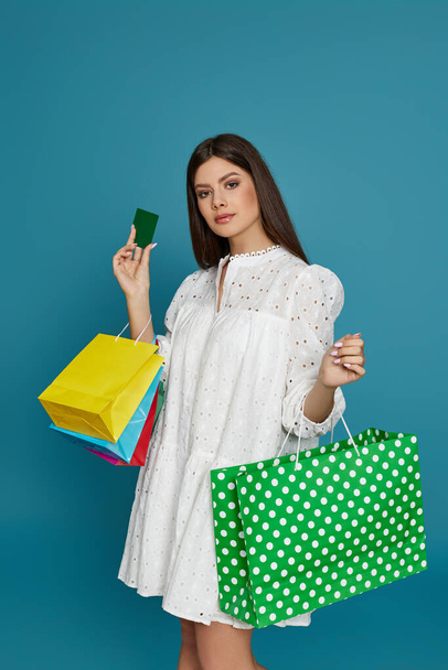 woman holding shopping bags , credit bank card - Φωτογραφία, εικόνα