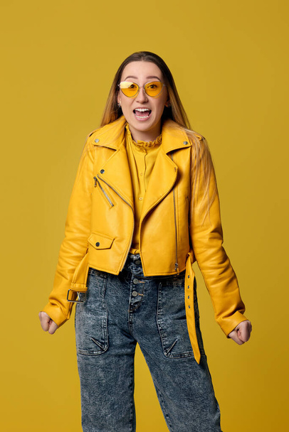 happy woman screaming on yellow background. Human emotions - Foto, Imagem