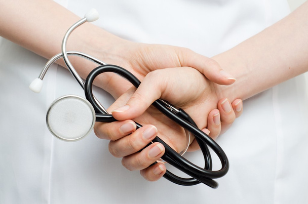 Doctor holding a stethoscope - Fotó, kép