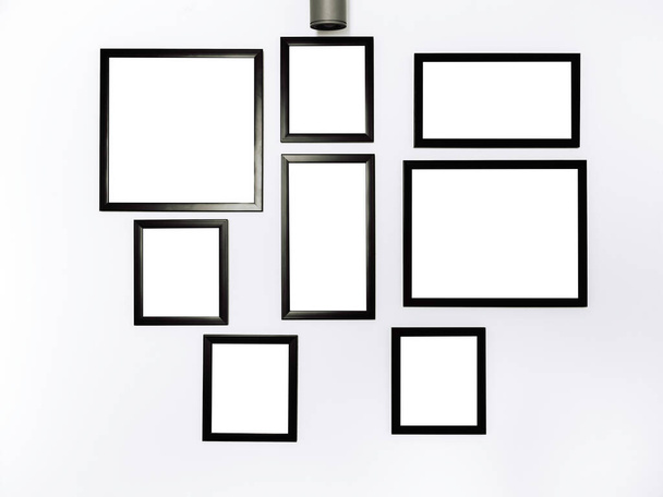 Skupina maketových fotorámečků. Bílý čtvercový obrázek s černým rámečkem mockup visí na bílém pozadí zdi. - Fotografie, Obrázek