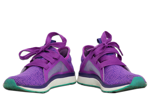 кольоровий кросівки пурпурового кольору або взуття ізольовані на білому
 - Фото, зображення