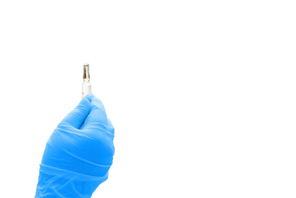 blue medical doctor glove hold ampule of drug isolated on white with copy space - Φωτογραφία, εικόνα