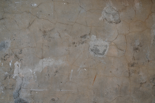 Bruin beton zand oude oude oppervlakte buitenmuur met crack textuur behang grunge achtergrond - Foto, afbeelding
