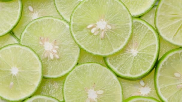 Top view limes slices rotation, close up. - 映像、動画
