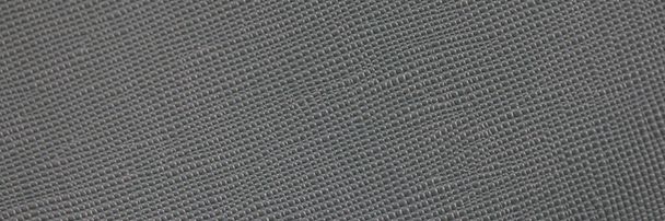 Texture of gray leather fabric, dark color tone of fabric pattern. - Photo, Image