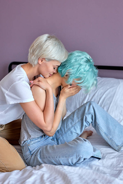 unhappy lesbian not talking to girlfriend after having quarrel on bed at home - Foto, Imagem