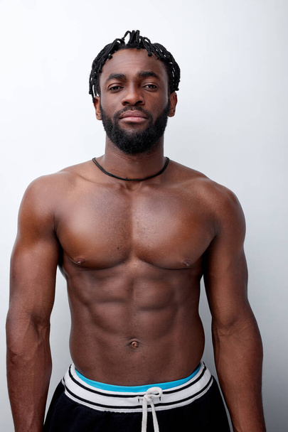 Confident Black Strong Bodybuilder Man With Naked Muscular Torso,Isolated On White - Valokuva, kuva