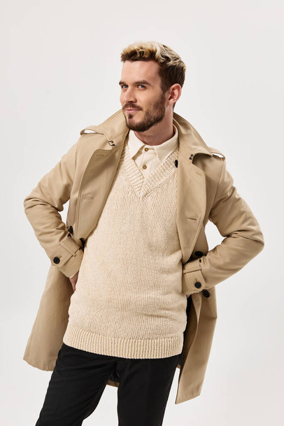 man in beige coat sweater autumn style attractive look - 写真・画像
