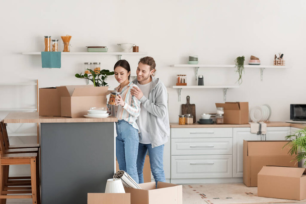 Young couple in kitchen on moving day - Photo, Image