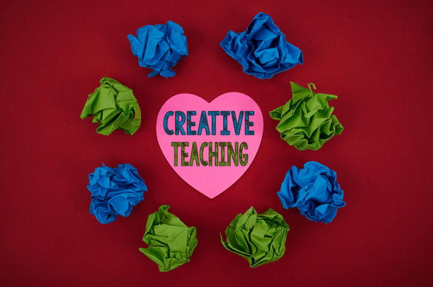 Conceptual display Creative Teaching. Concept meaning the act of coaching in novel way that promotes growth Colorful Crumpled Papers Circular Pattern Surrounding Heart Shaped Card. - Photo, Image